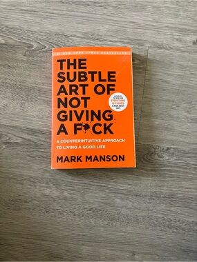 3/$15 The Subtle Art of Not Giving a F*ck by Mark Manson - Bright Orange Cover